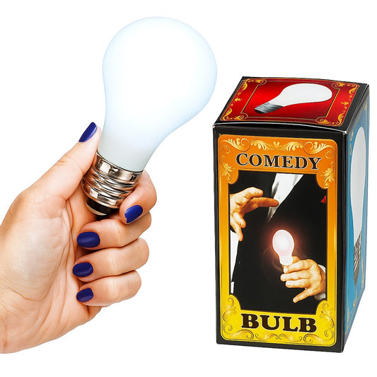 Hand holding a light bulb next to a box labeled 'Comedy Bulb' on a white background